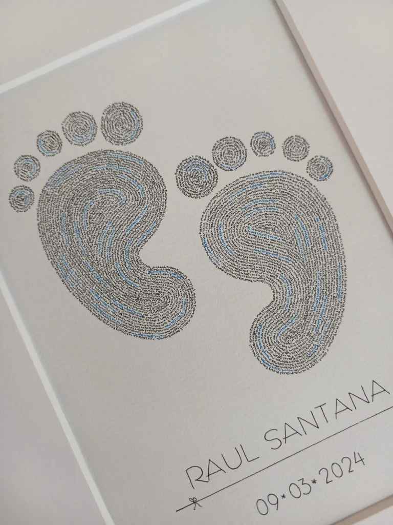 Birth calligram of two baby feet, written in black and blue with the name of the baby, with name and birth date below