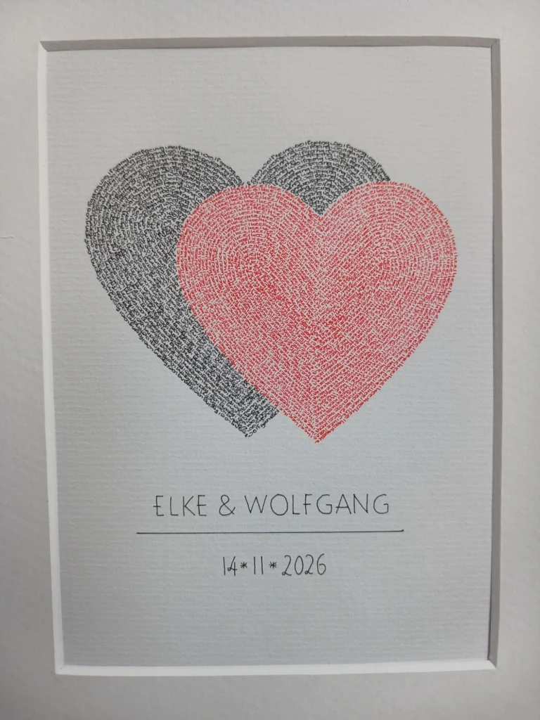 Wedding calligram of two overlapping hearts, one black and one red, written with the names of the couple, with names and date below