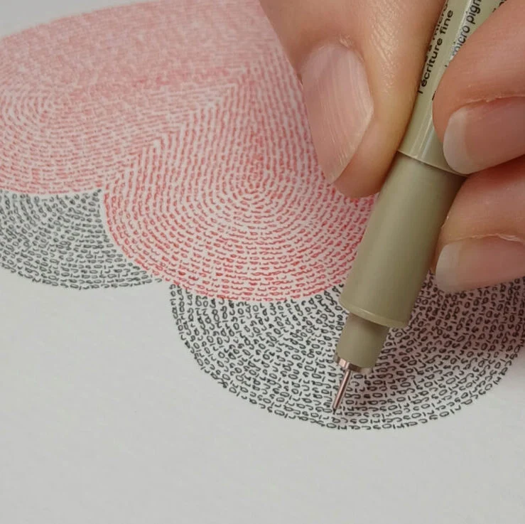 Handwritten words in black and red forming two intertwined hearts – calligram by Mirjam Polman